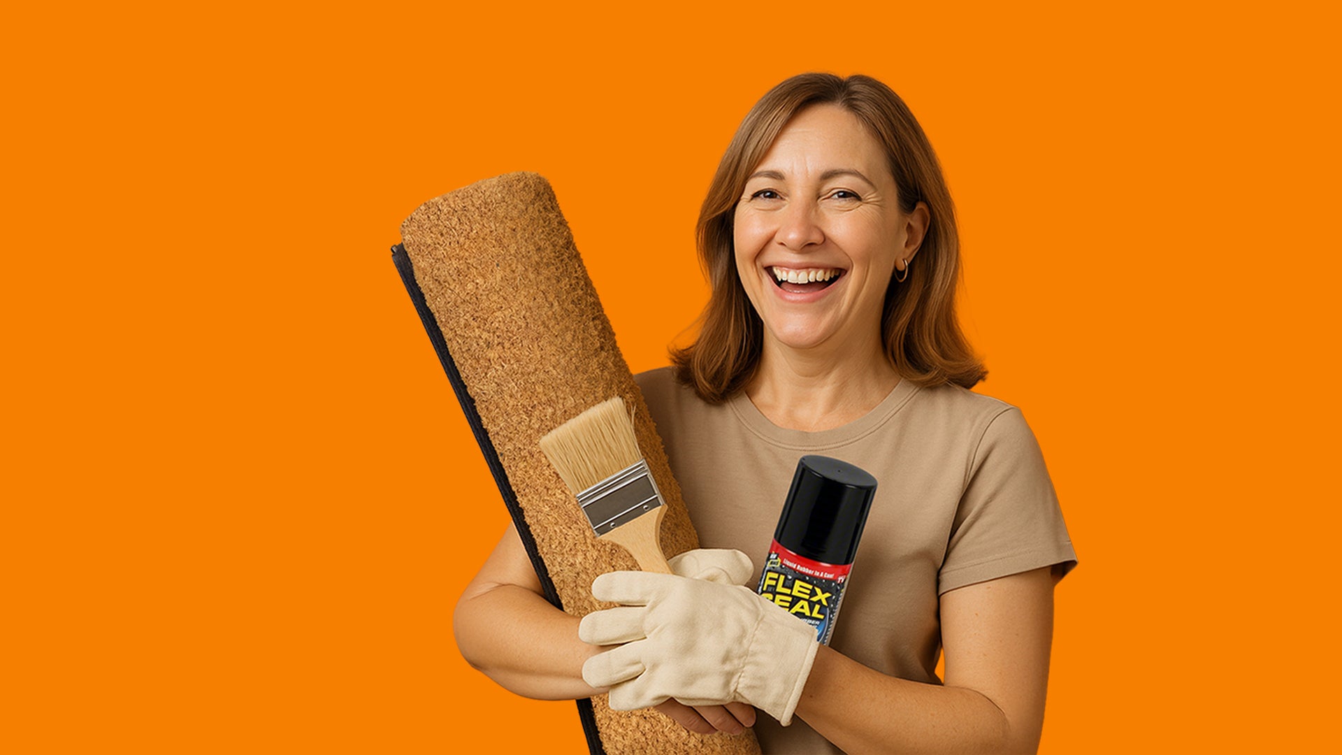 Woman holding a paint roller, coir mat, brush, and can of Flexall paint against an orange background